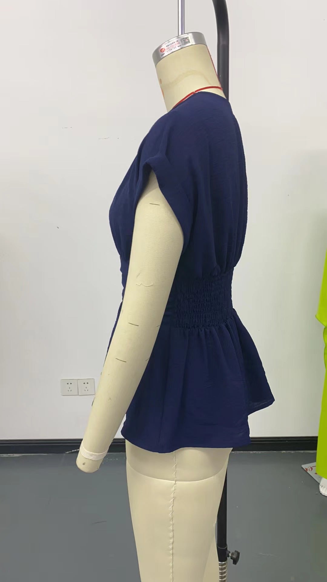 V-neck, fitted waist, raglan sleeve, pleated skirt T-shirt