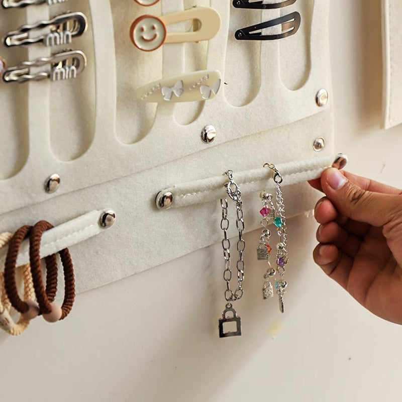 Wall-mounted storage bag behind the door