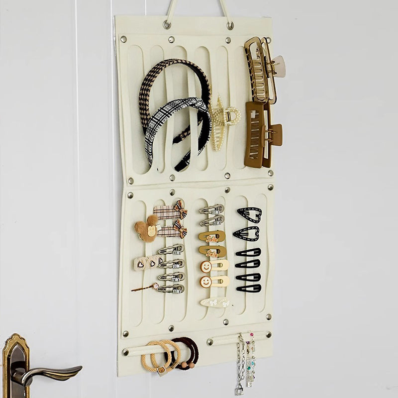 Wall-mounted storage bag behind the door