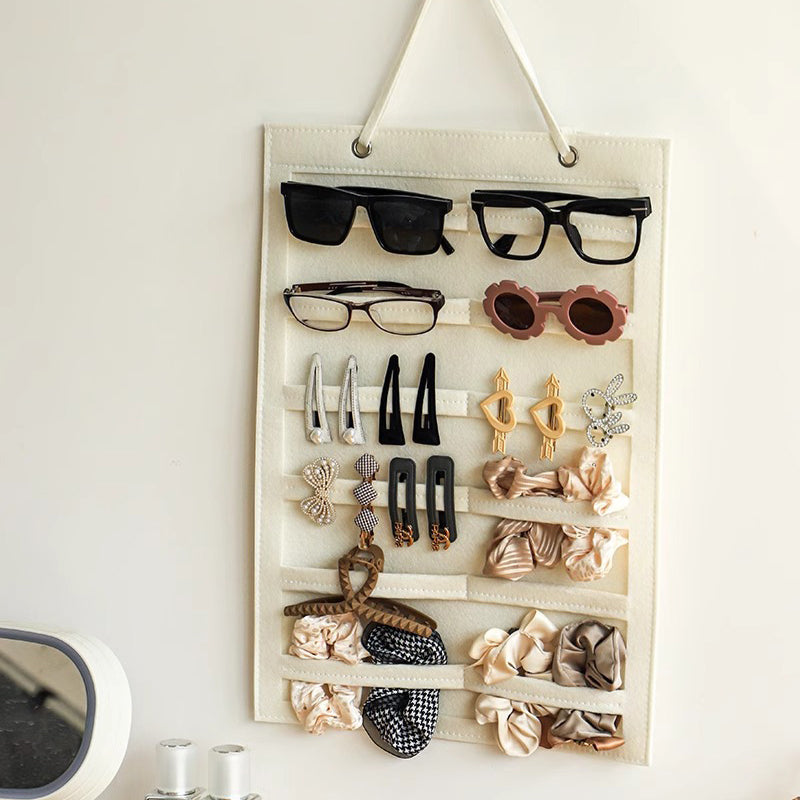 Wall-mounted storage bag behind the door