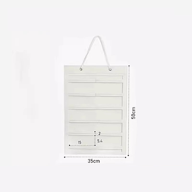 Wall-mounted storage bag behind the door